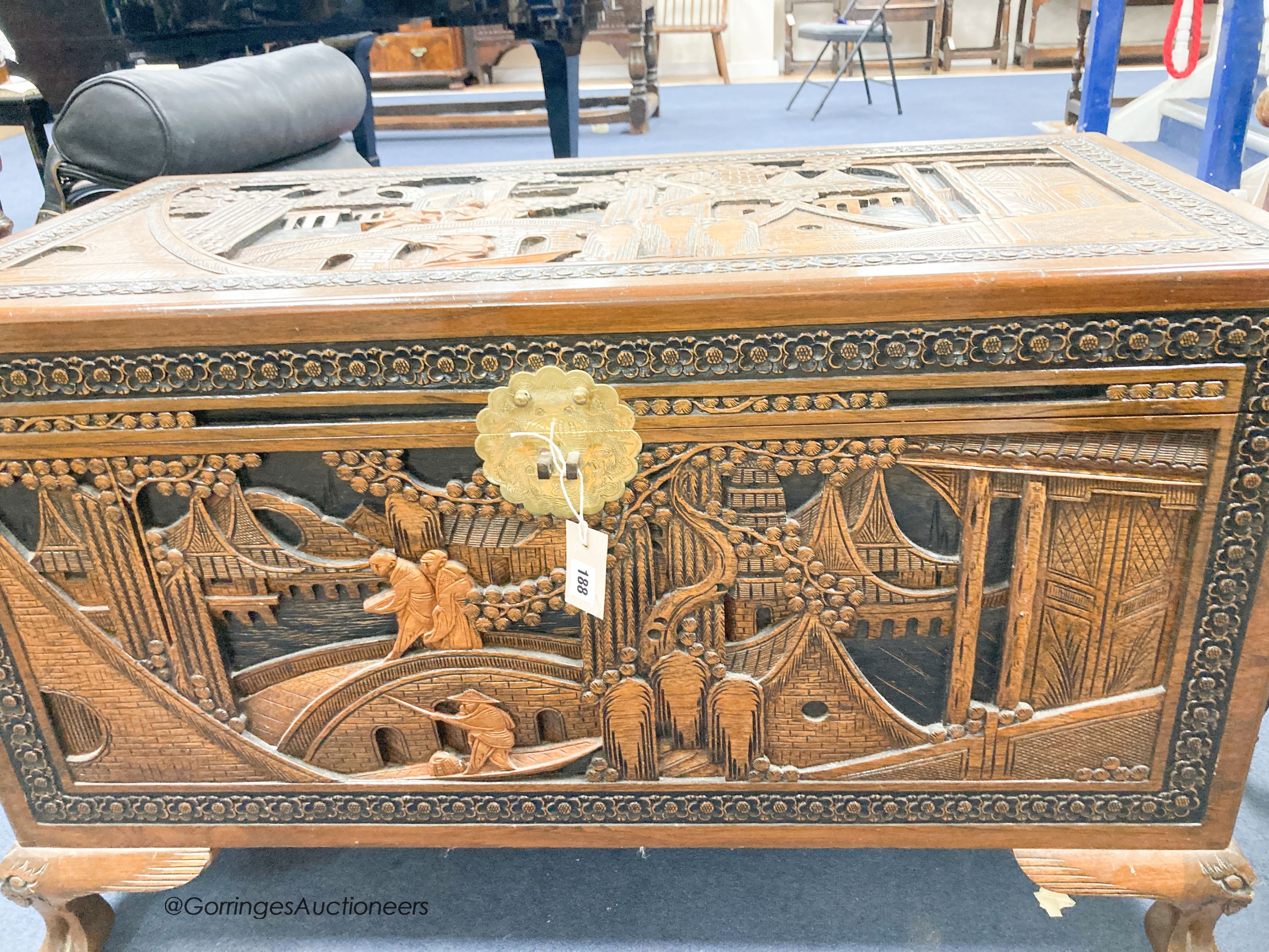 A Chinese carved camphorwood chest, width 102cm, depth 52cm, height 62cm